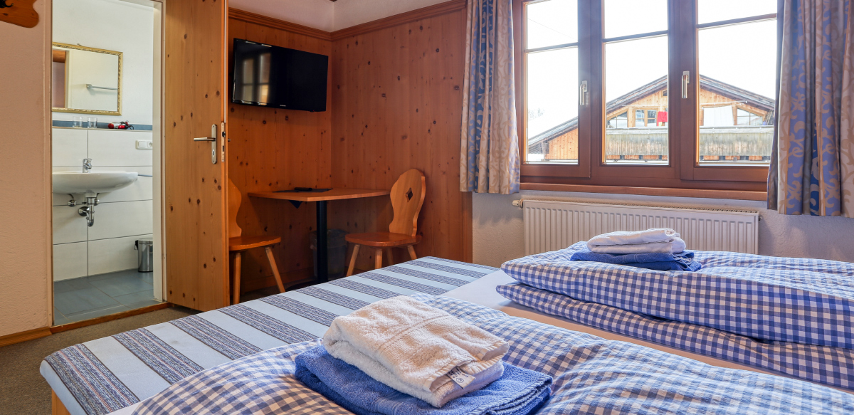 Doppelzimmer Standard ohne Balkon - Schlafzimmer | Berggasthof Sonne in Sonthofen
